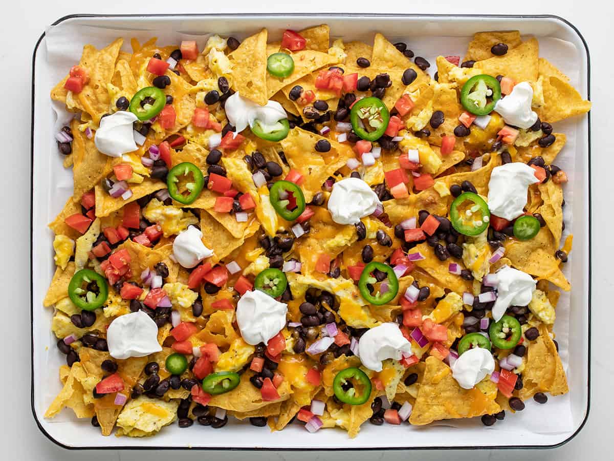 Finished breakfast nachos with fresh toppings added.