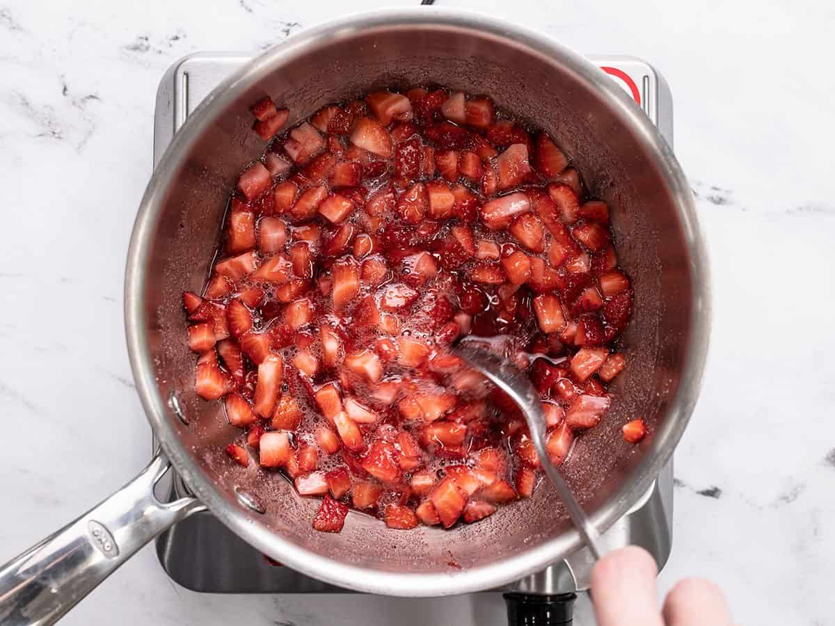 Strawberries releasing their liquid and turning into syrup.