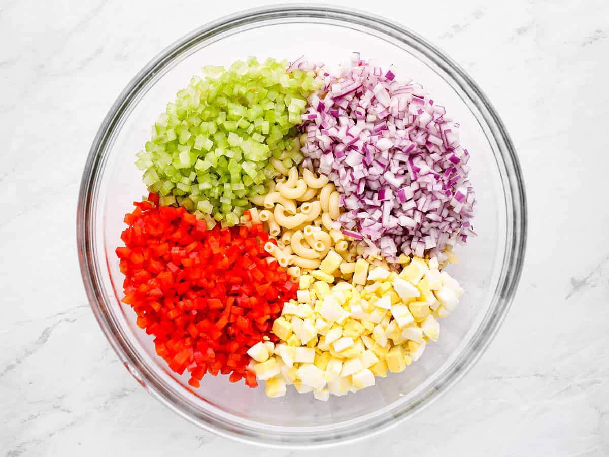 Macaroni and salad ingredients in a bowl.