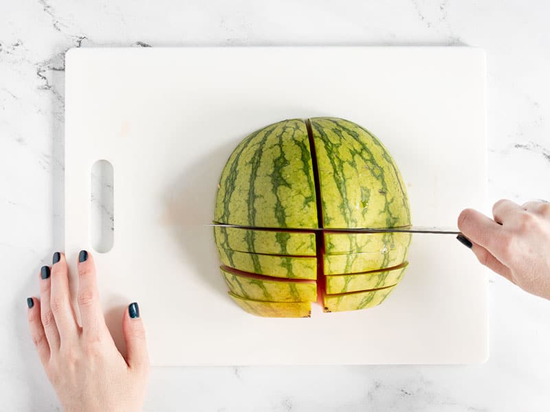 Cut watermelon half into slices