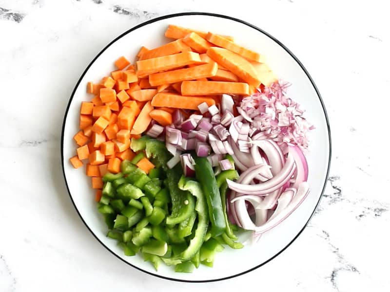 Sliced, diced, and minced red onion, bell pepper, and sweet potato