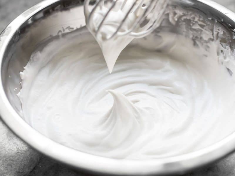 Soft peak in a bowl of homemade whipped cream