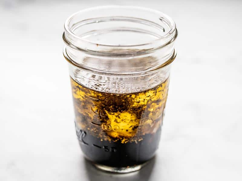 Balsamic vinaigrette ingredients in a mason jar