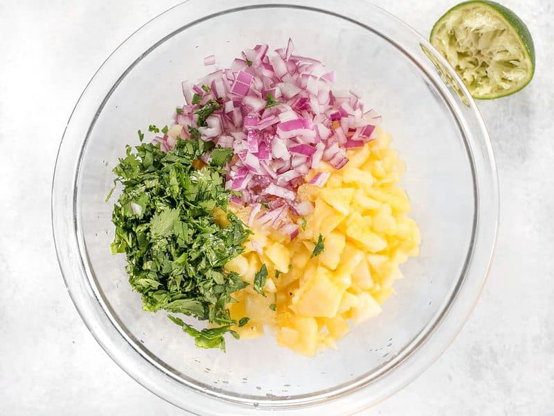 Pineapple Cilantro Onion and Lime juice in a bowl