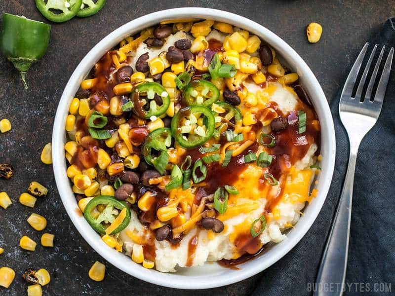 Creamy potatoes make the perfect base for a pile of colorful and flavorful toppings in these Loaded Mashed Potato Bowls. Perfect for meal prep!