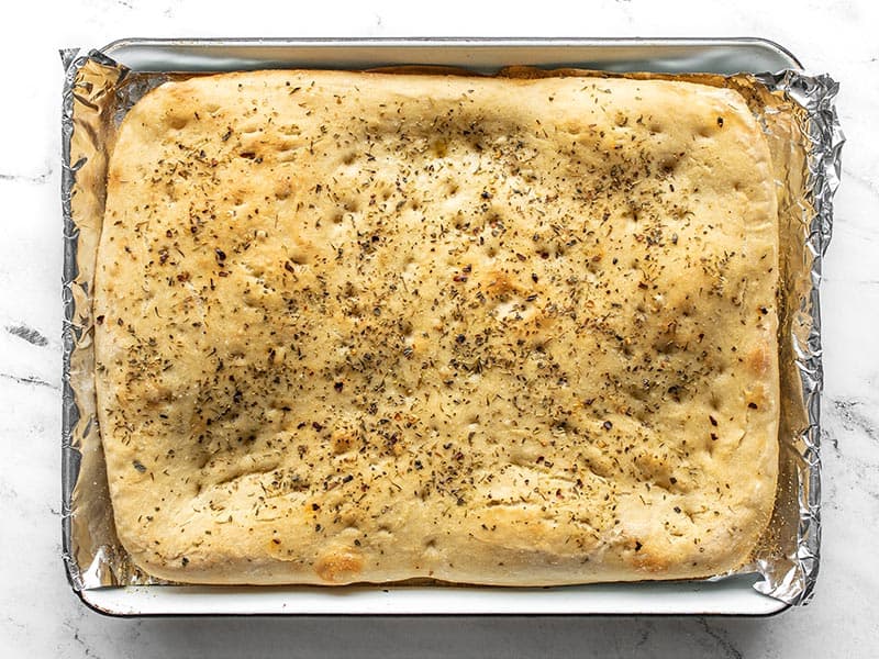 Baked focaccia on the baking sheet