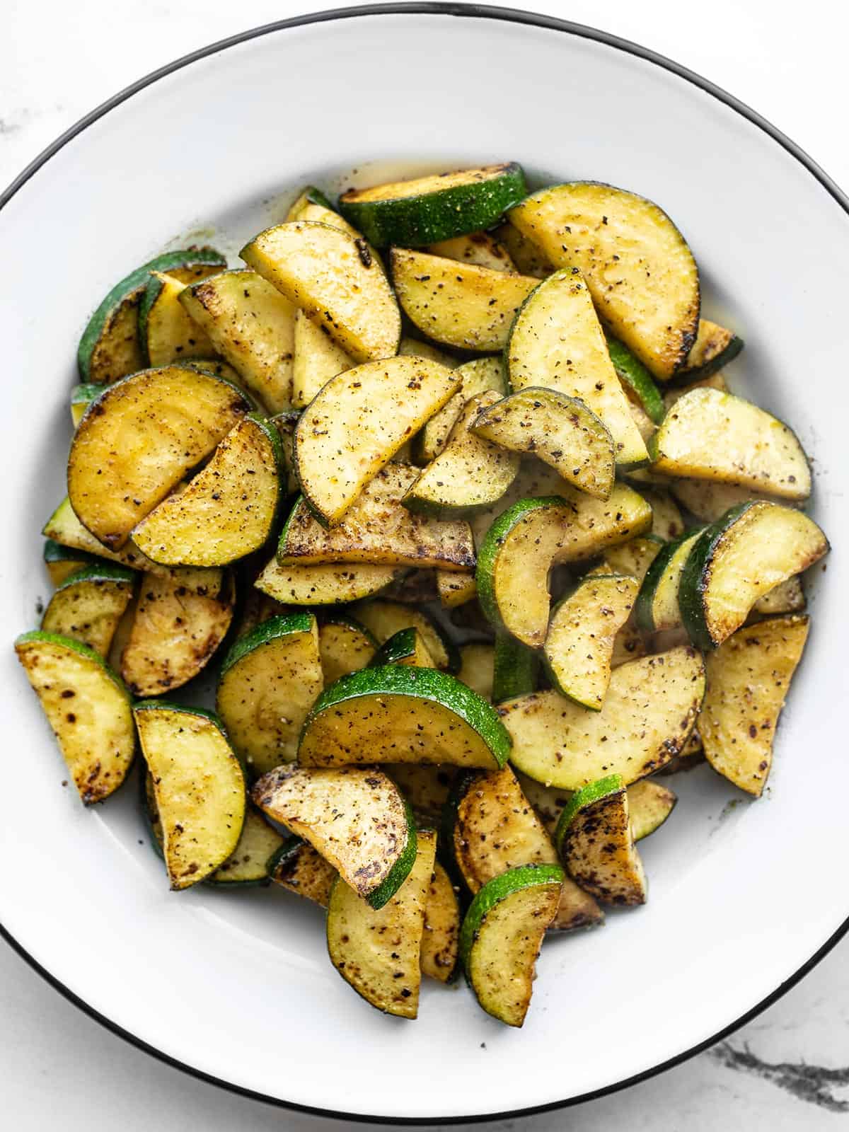 Overhead view of a bowl of lemon pepper zucchini