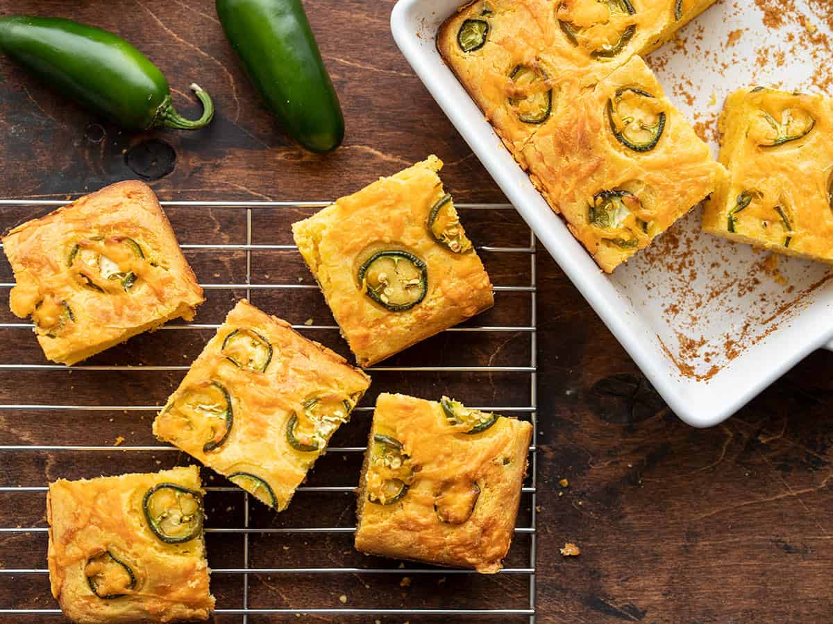 Jalapeño Cheddar Cornbread half in the baking dish and half on a cooling rack