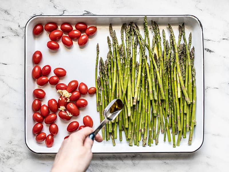 Asparagus and Tomatoes on the baking sheet