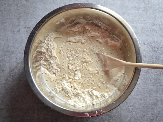 Yeast water added to dry ingredients in the mixing bowl