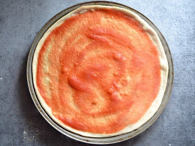 Par Baked pizza crust with tomato sauce