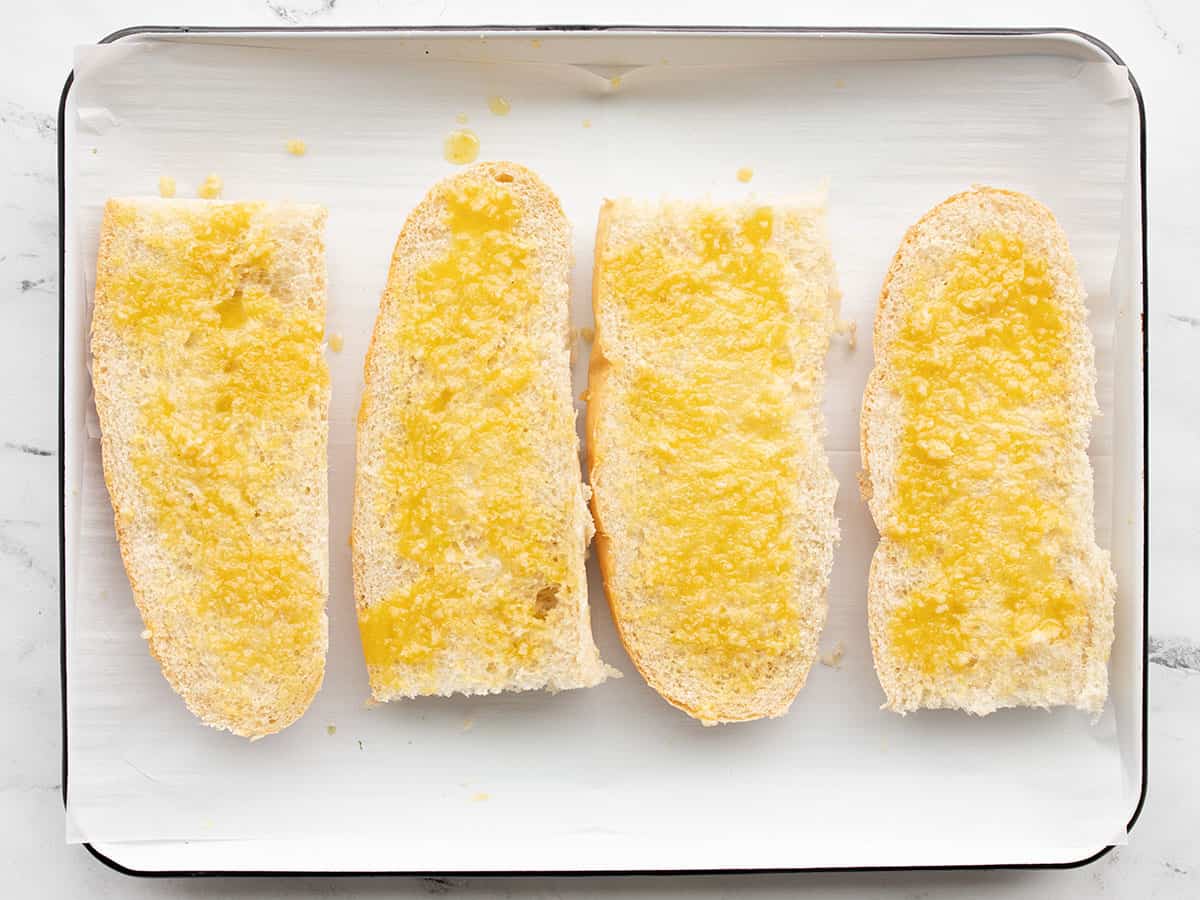 Garlic butter bread on a baking sheet.