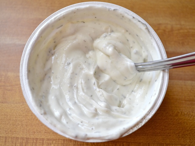 dill yogurt sauce mixed in yogurt container