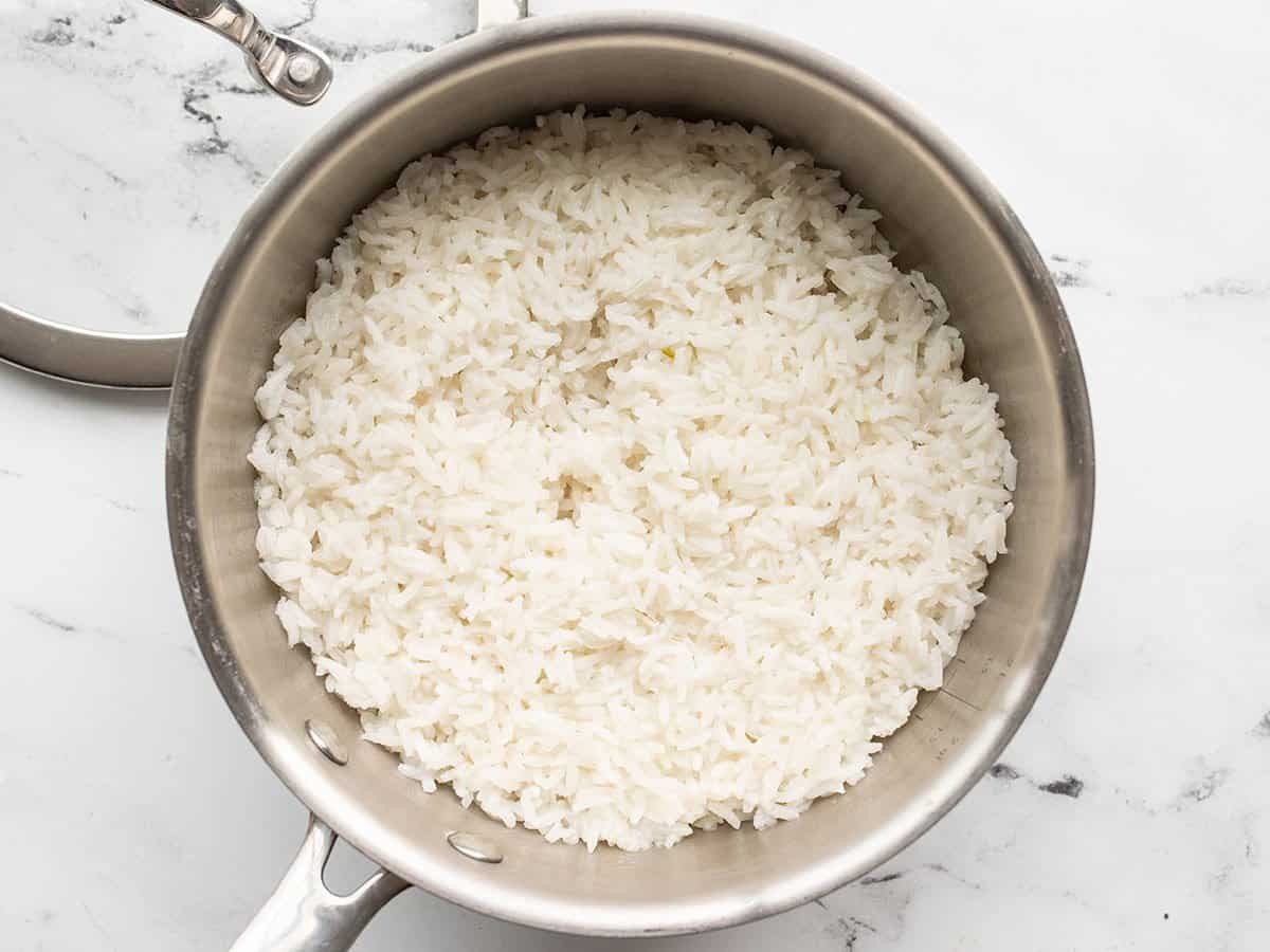 Cooked rice in the saucepot.
