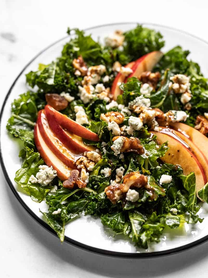 Close up front view of an Autumn Kale and Apple Salad with Balsamic Vinaigrette