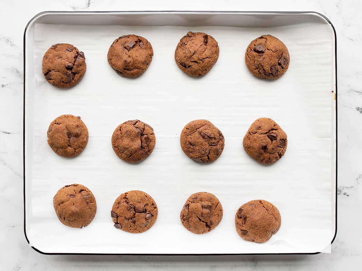 Baked molasses cookies on a baking sheet