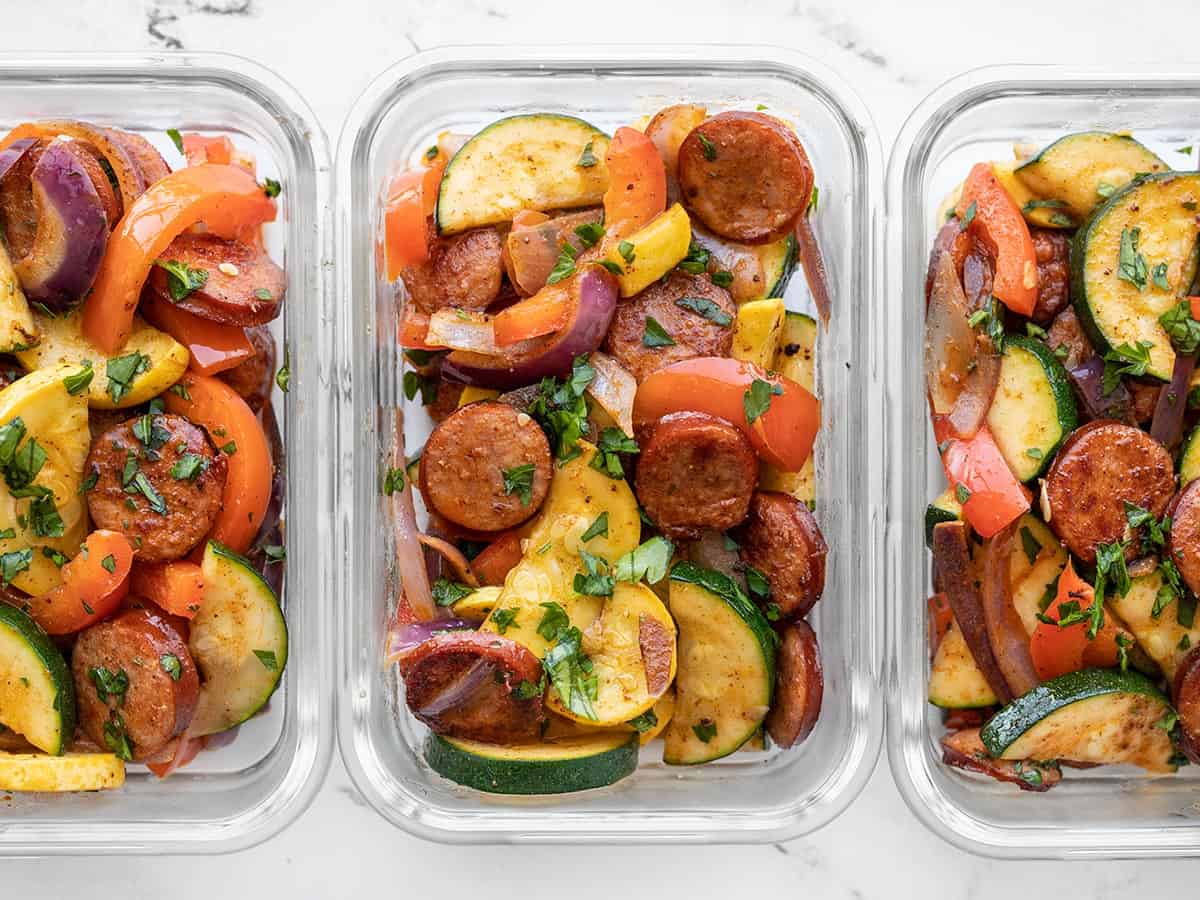 rectangular glass containers with Cajun Sausage and Vegetables lined up