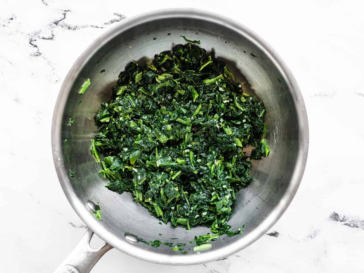 Thawed spinach added to the saucepot