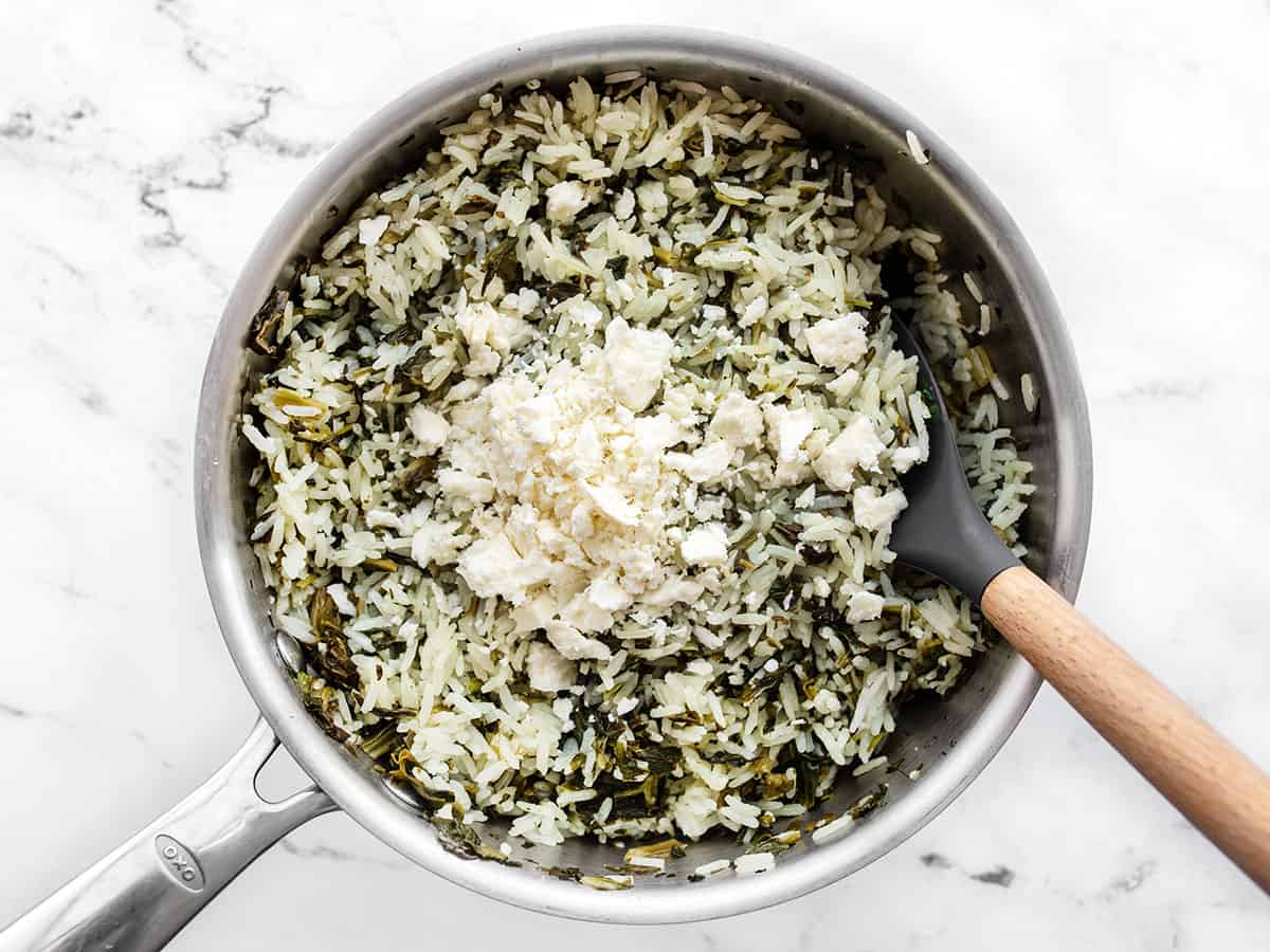 crumbled feta added to rice