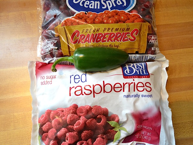 bag of cranberries and bag of raspberries with one whole jalapeno 