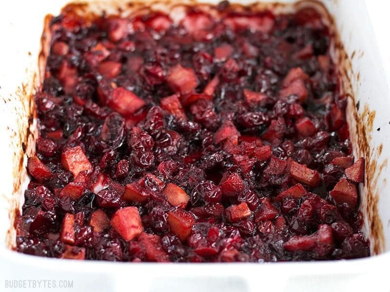 Close up of Roasted Apple Cranberry Relish in the casserole dish, viewed from the front.