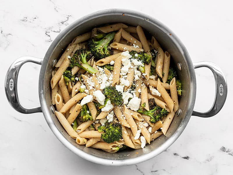 Feta added to pasta in the pot