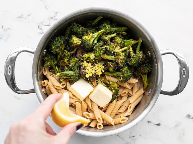 Pasta, broccoli, butter, and lemon combined in the pot.