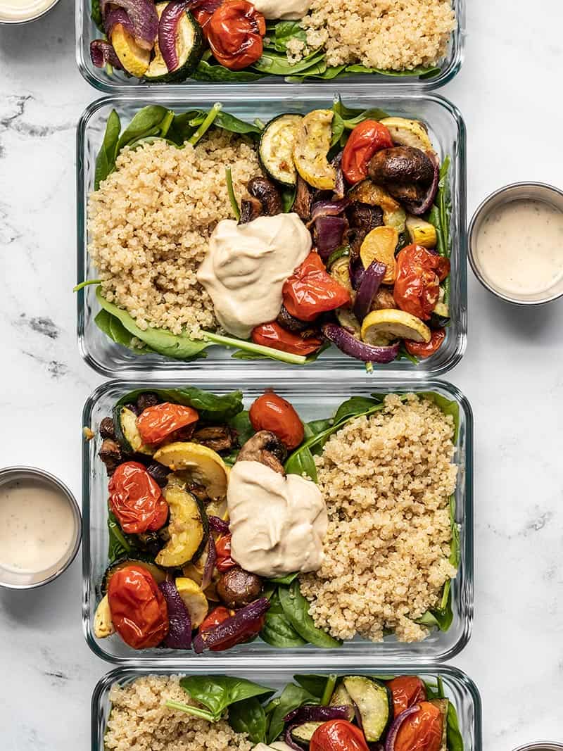Glass meal prep containers with Roasted Vegetable Salad in a row.