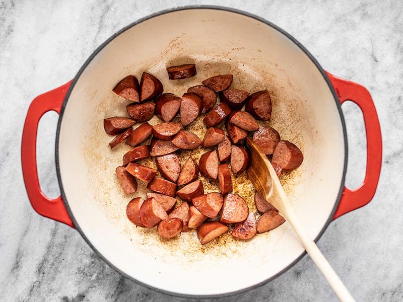Browned Smoked Sausage slices in a large pot