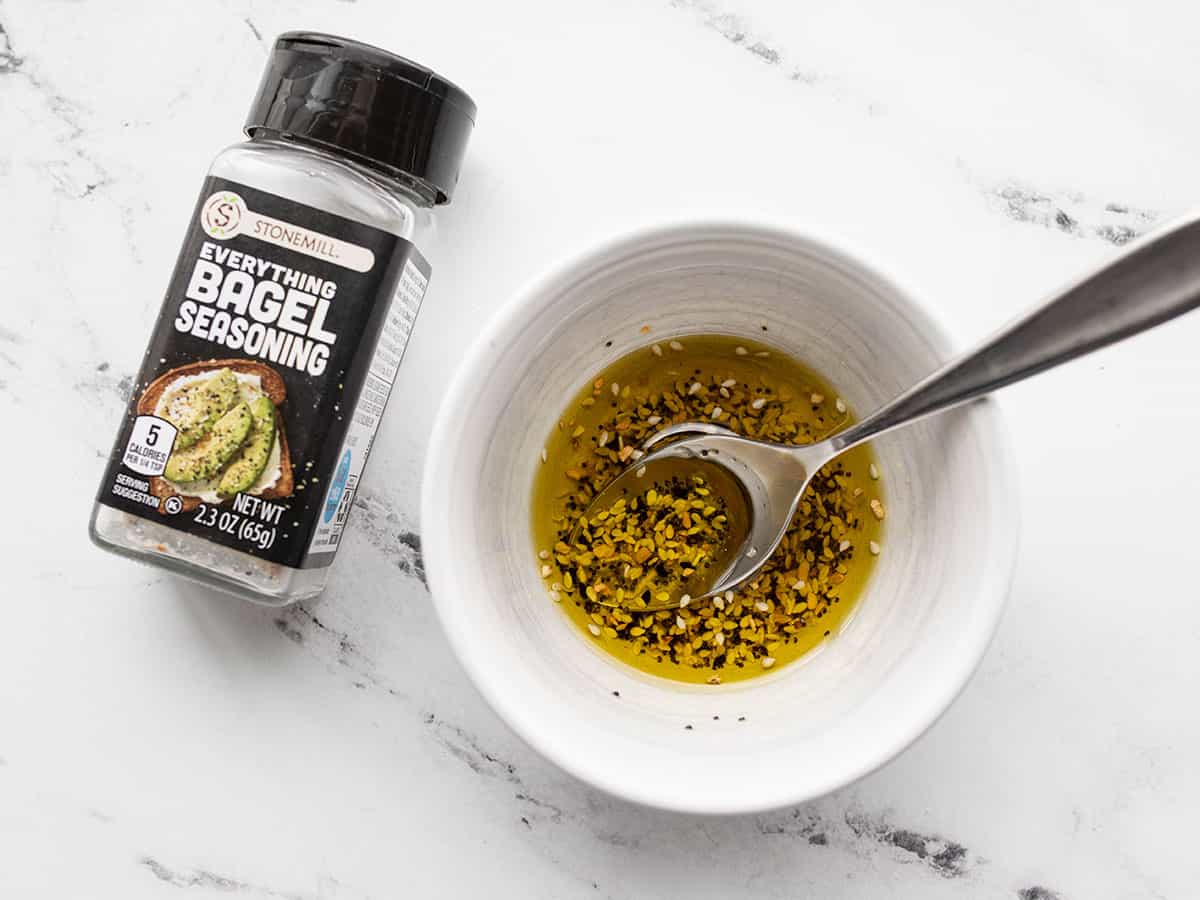 Olive oil and everything bagel seasoning in a bowl