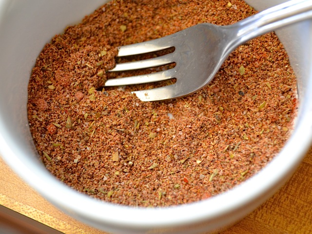 taco seasoning in small bowl with fork 