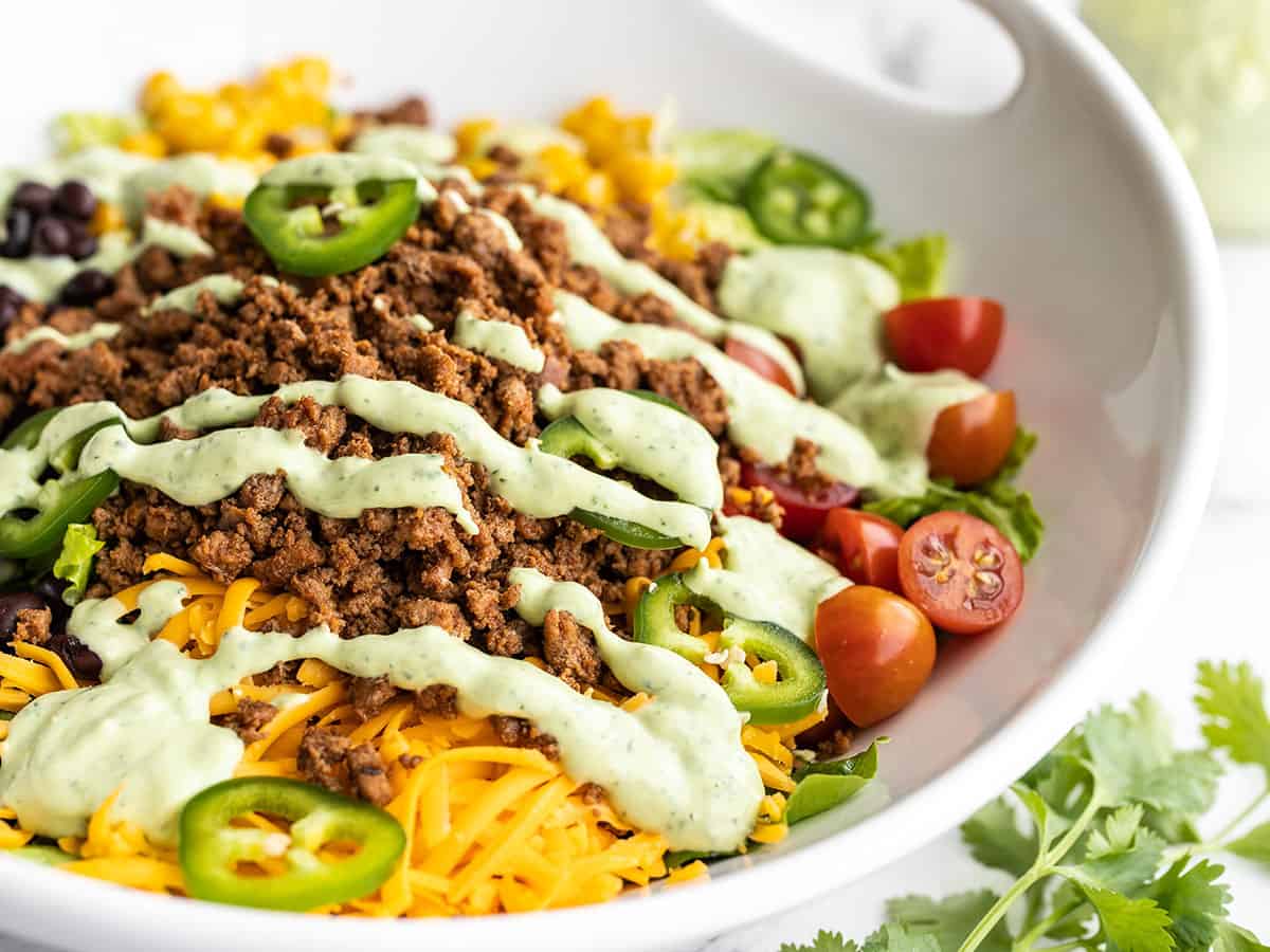 Close up side view of turkey taco salad in a serving bowl