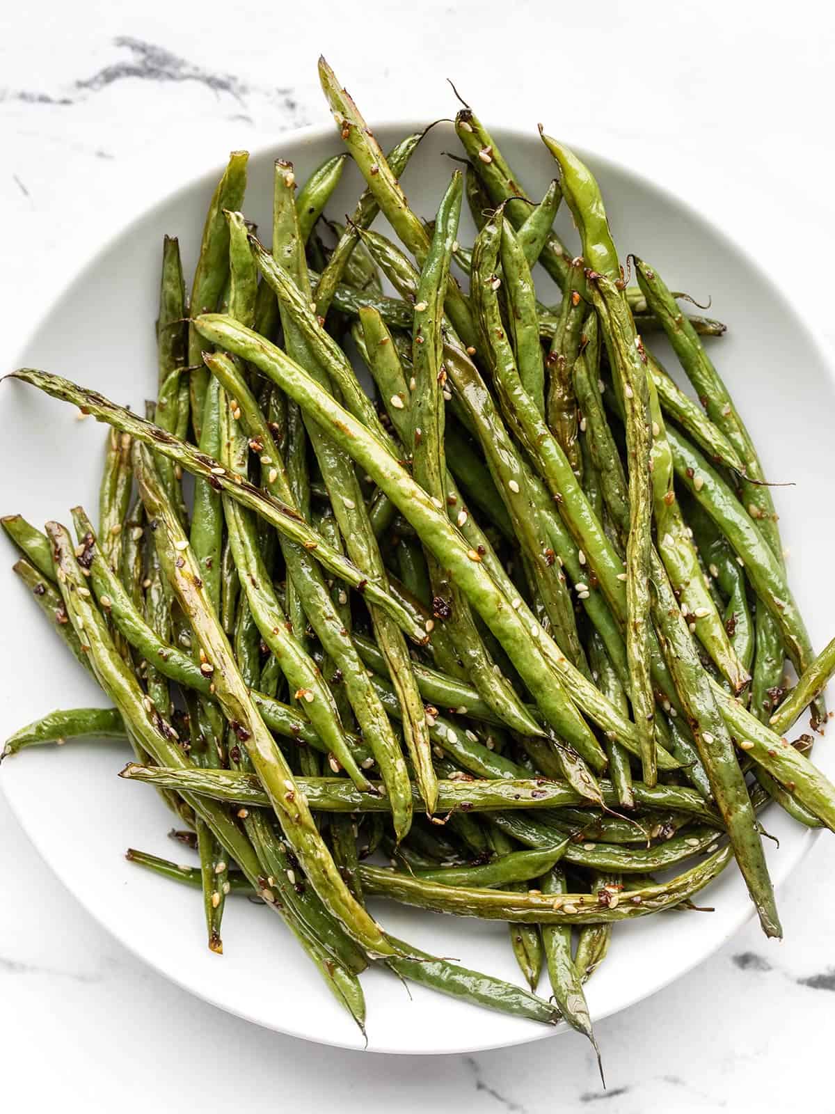Sesame Roasted Green Beans on a plate, viewed from above