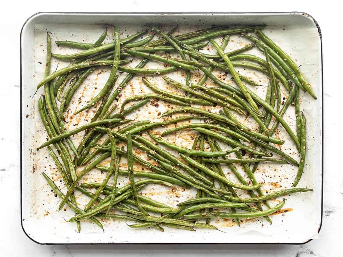 Finished sesame roasted green beans on the baking sheet