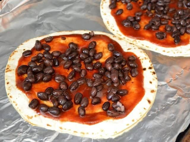 Black Beans sprinkled on top of bbq sauce 
