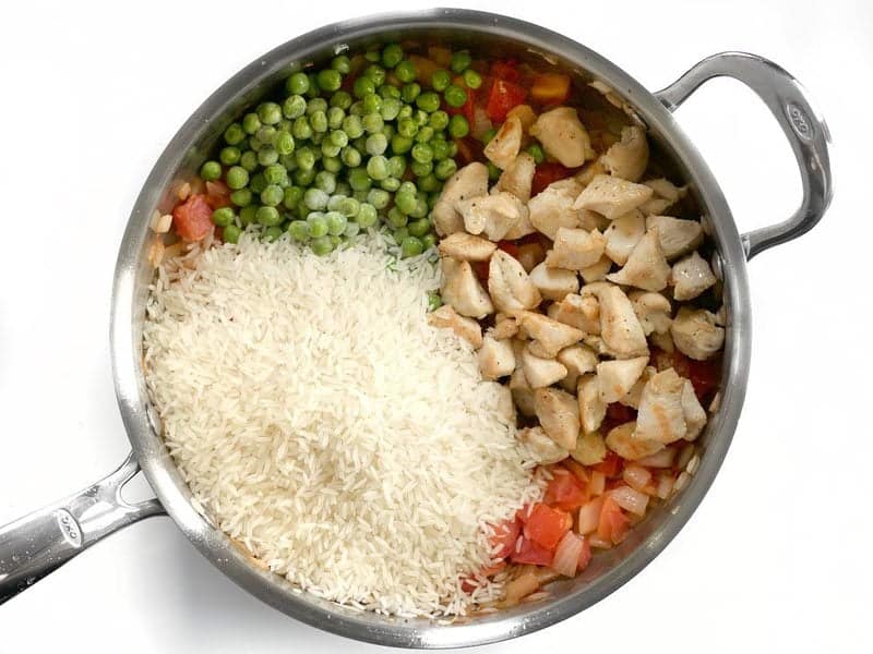 Add Rice Chicken and Peas to the skillet