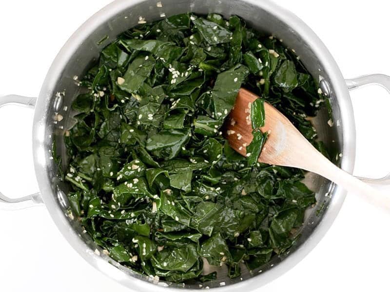 Add Soy Sauce Sesame Oil and Sesame Seeds to kale in pot